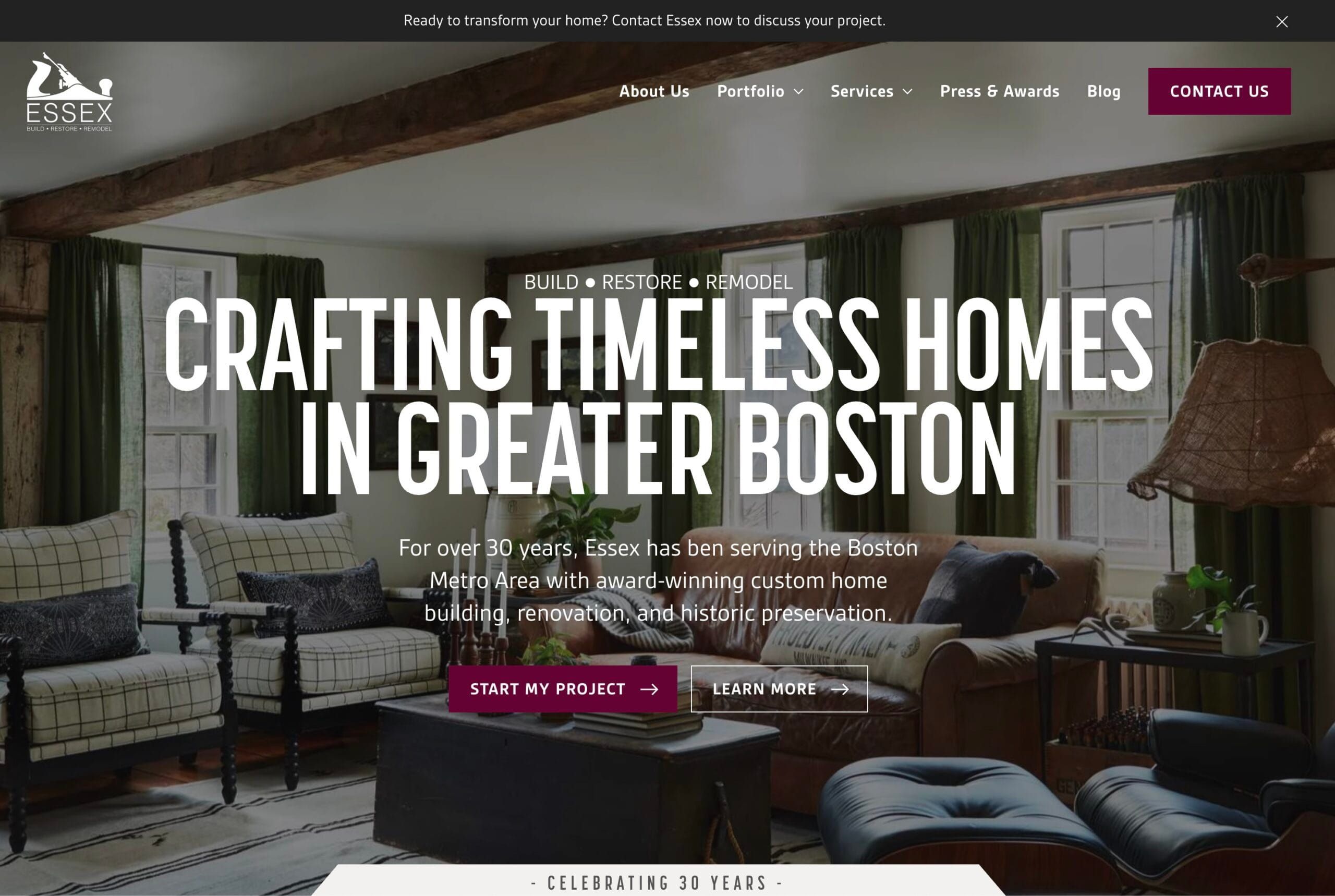 A custom home builder website shown on a laptop